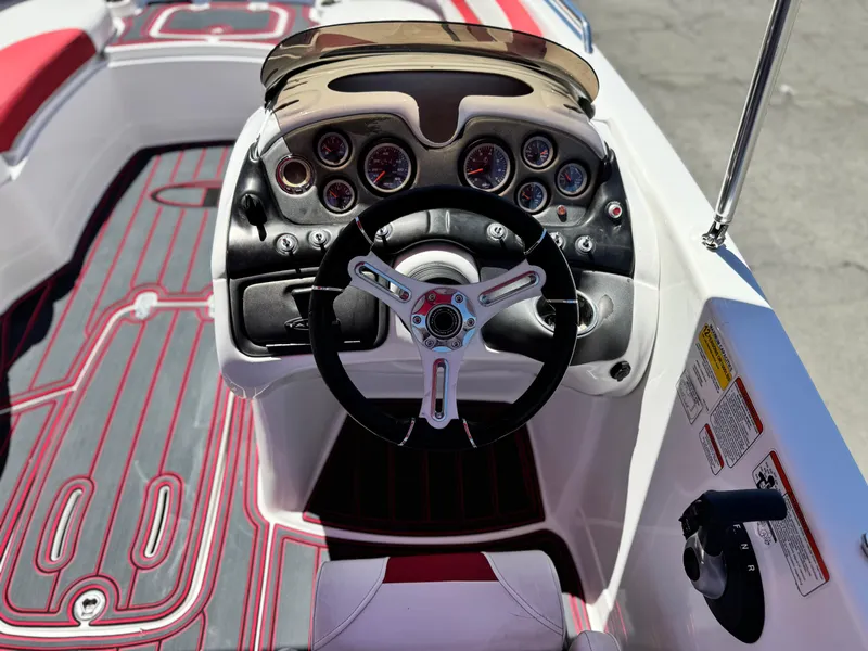 Slide: The Image of 2018 Tracker TAHOE 215 XI boat dashboard with steering wheel and gauges. - 28