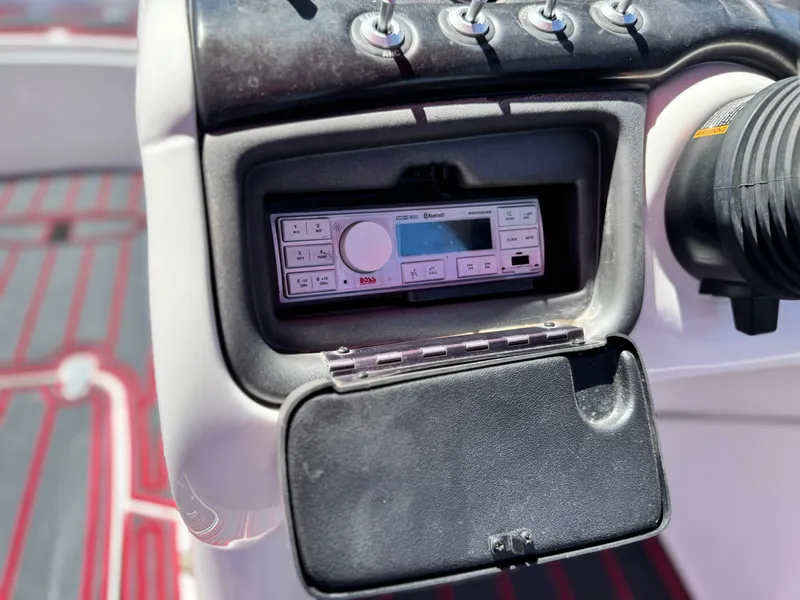 Slide: The Image of 2018 Tracker TAHOE 215 XI boat dashboard with Boss audio system. - 29