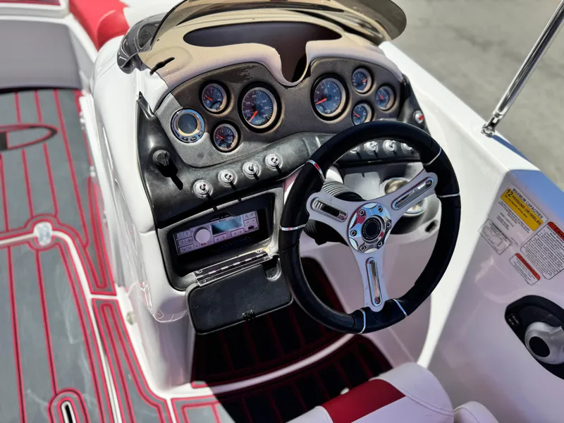 Slide: The Image of 2018 Tracker TAHOE 215 XI boat dashboard with steering wheel and gauges. - 30