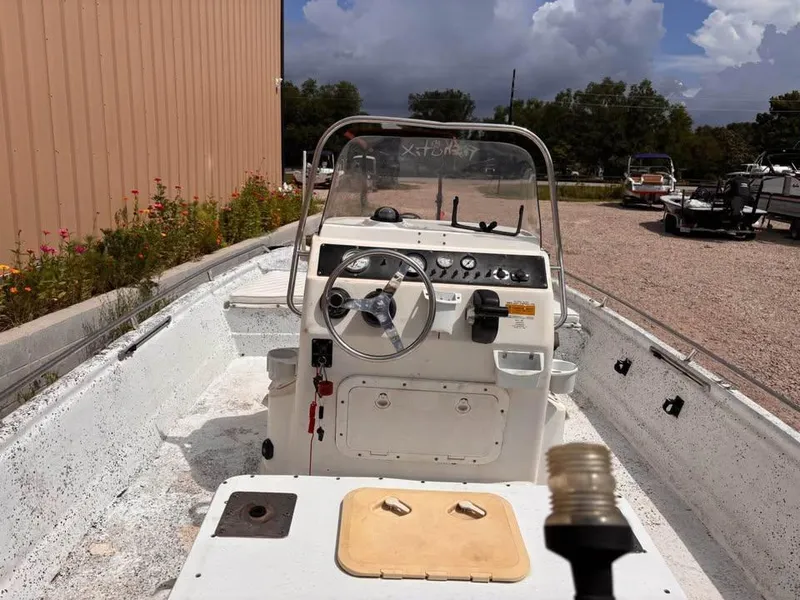 Slide: The Image of 2000 Bay Stealth 1880 Liner boat interior with steering console and gauges. - 10