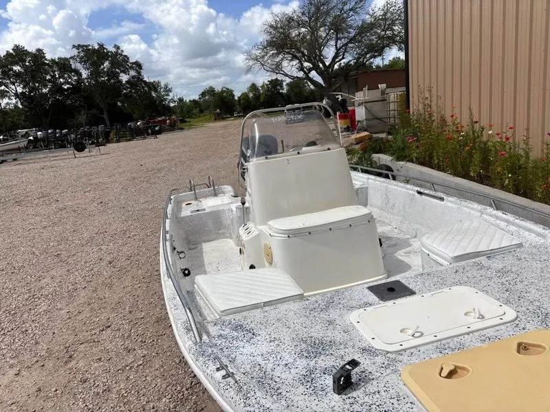 Slide: The Image of 2000 Bay Stealth 1880 Liner boat parked outdoors on gravel near a building. - 7