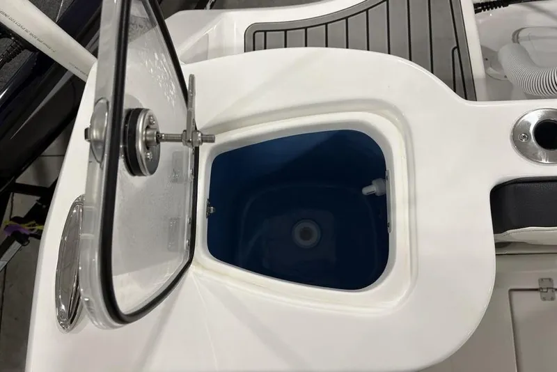 Slide: The Image of Open storage compartment on 2026 Tidewater 232 CC Adventure boat. - 15