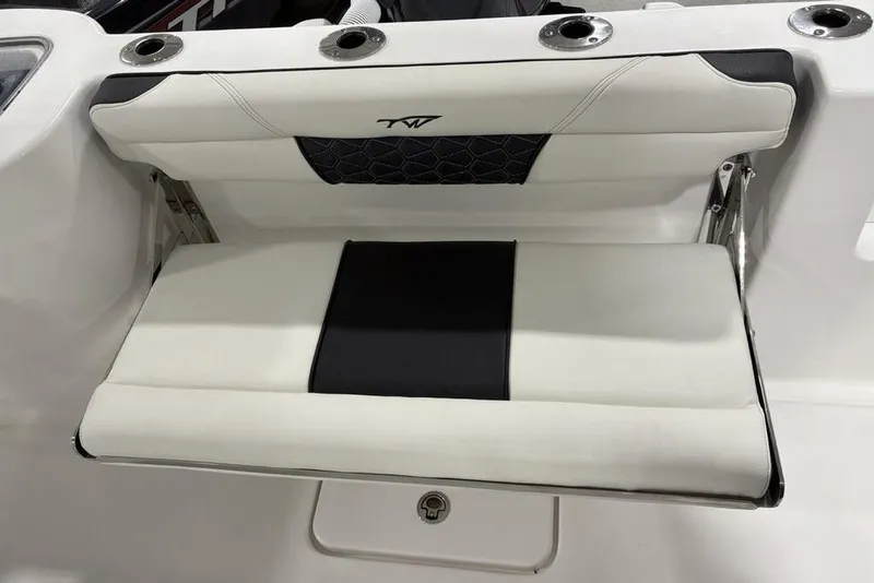 Slide: The Image of 2026 Tidewater 232 CC Adventure boat seat with black and white upholstery. - 18