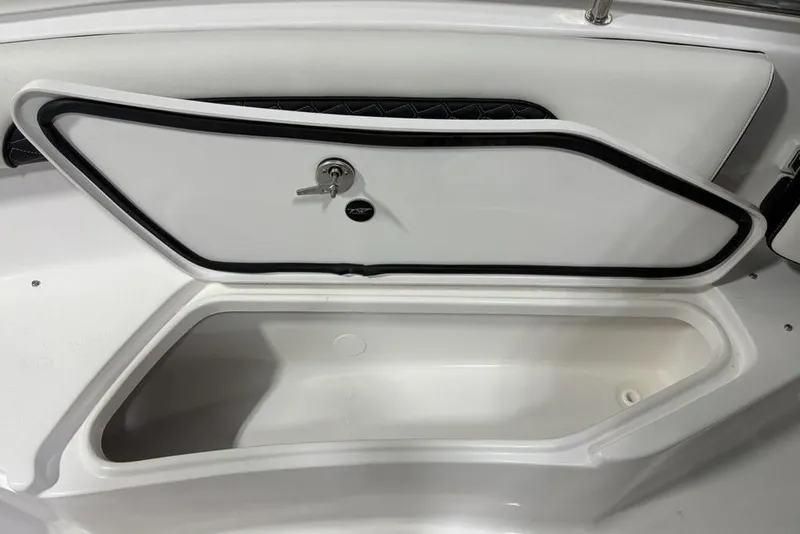 Slide: The Image of Storage compartment on 2026 Tidewater 232 CC Adventure boat, featuring secure lock and sleek design. - 2