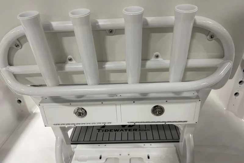 Slide: The Image of 2026 Tidewater 232 CC Adventure boat rod holders and storage compartments. - 23