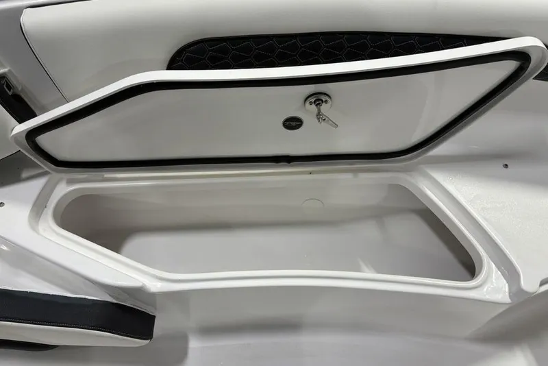 Slide: The Image of Storage compartment of 2026 Tidewater 232 CC Adventure boat, featuring secure lock and key. - 3