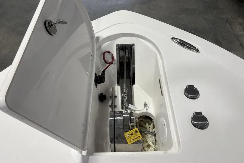 Slide: The Image of Anchor compartment of 2026 Tidewater 232 CC Adventure boat, featuring storage and hardware. - 5