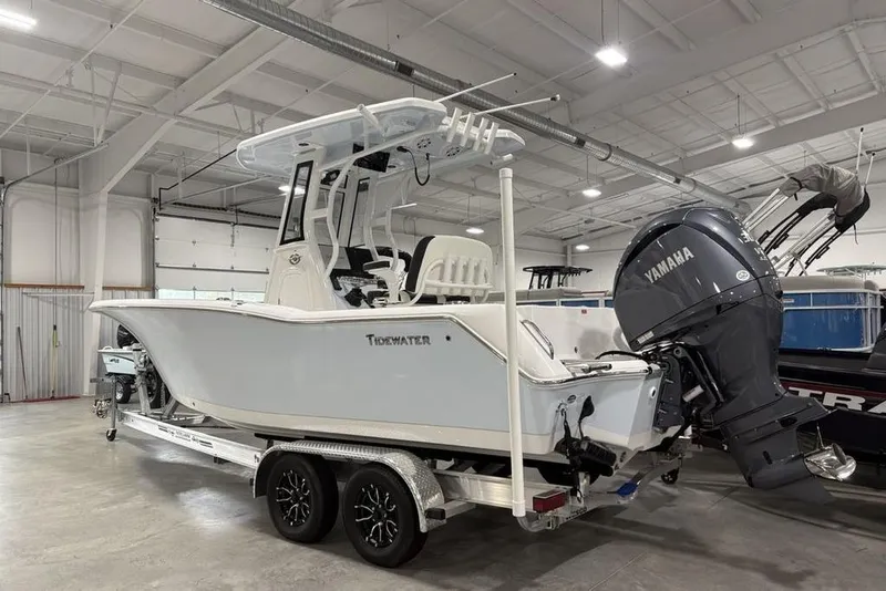 Slide: The Image of 2026 Tidewater 232 CC Adventure boat with Yamaha engine in a showroom. - 7