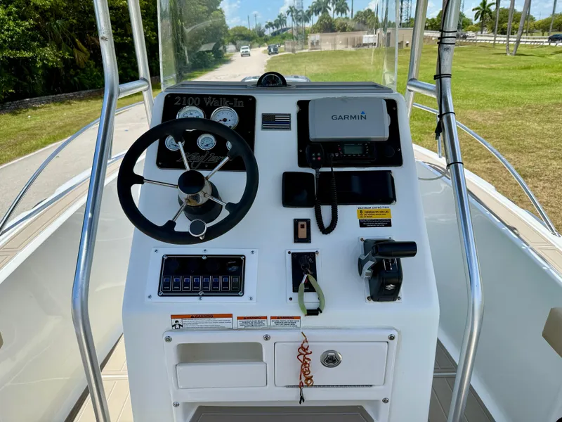Slide: The Image of 2016 Key Largo 2100 WI CC boat deck with storage compartments and speaker. - 10
