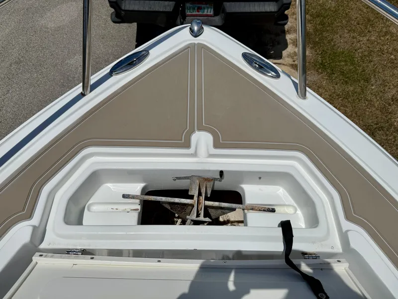 Slide: The Image of Open storage compartment on 2016 Key Largo 2100 WI CC boat with assorted items inside. - 20