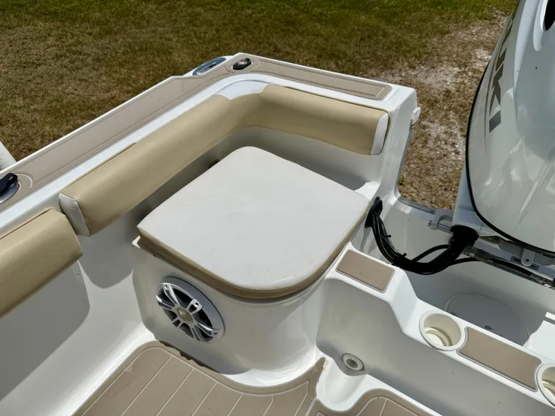 Slide: The Image of 2016 Key Largo 2100 WI CC boat with Suzuki outboard motor, palm trees in background. - 29