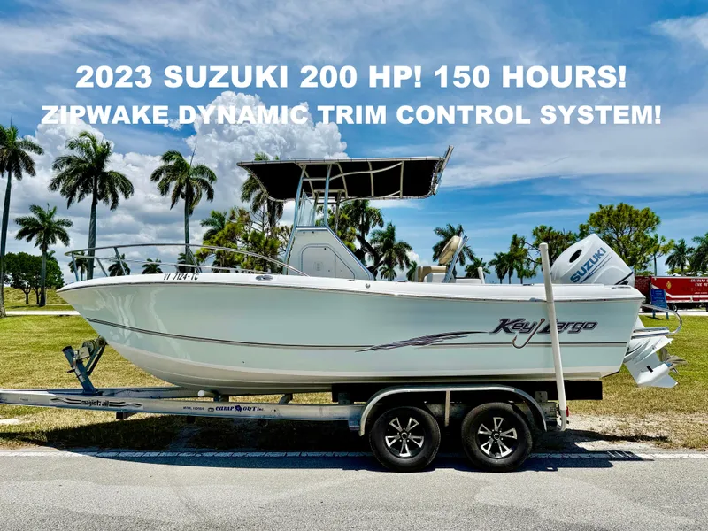 The Image of 2016 Key Largo 2100 WI CC boat with 2023 Suzuki 200 HP engine on trailer. - 0