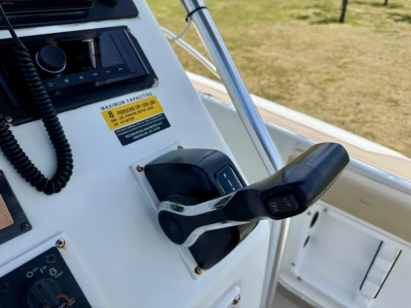 Slide: The Image of Control panel of 2016 Key Largo 2100 WI CC boat with throttle and radio. - 16