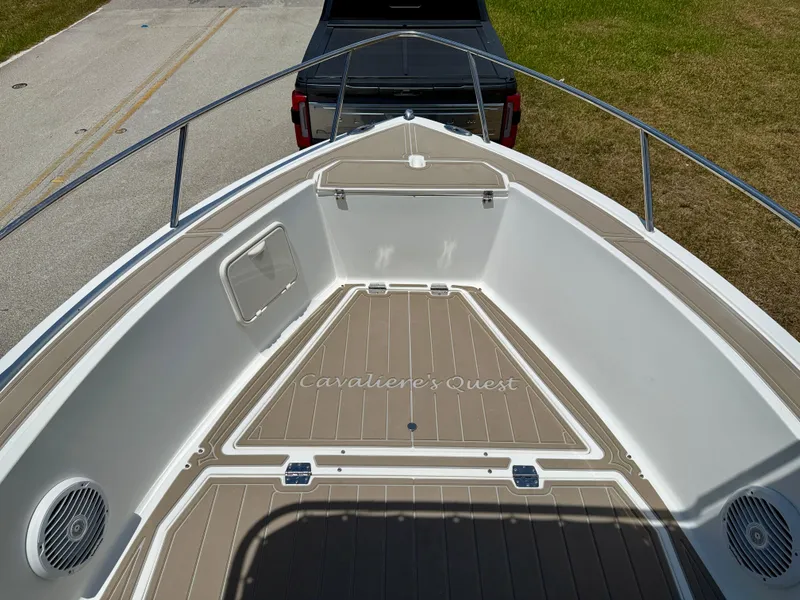 Slide: The Image of 2016 Key Largo 2100 WI CC boat deck, "Cavaliere's Quest," parked on a trailer. - 17