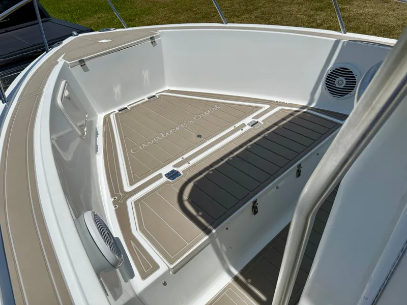 Slide: The Image of 2016 Key Largo 2100 WI CC boat interior with tan deck and speaker. - 18