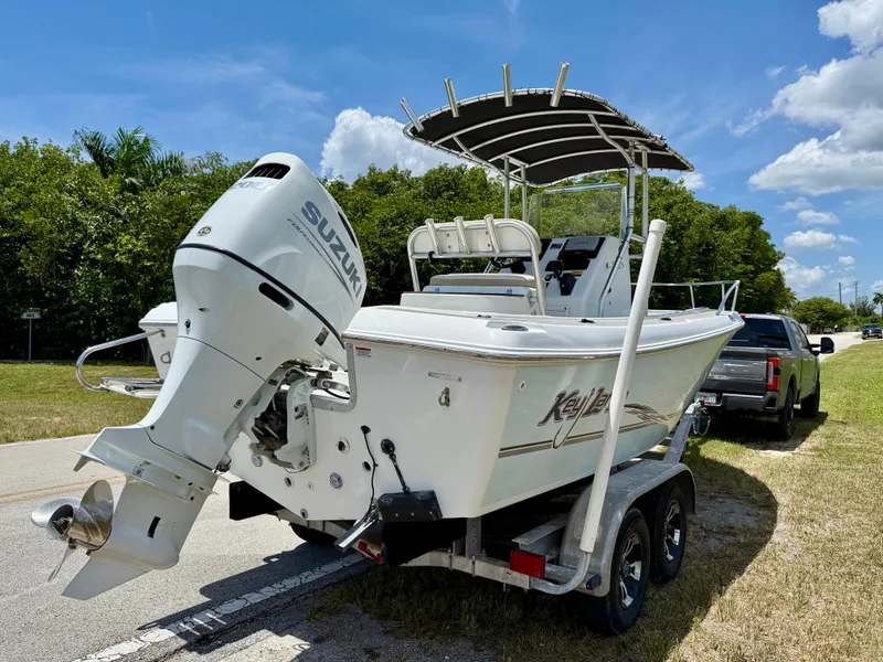 Slide: The Image of 2016 Key Largo 2100 WI CC boat on trailer with Suzuki outboard motor. - 4