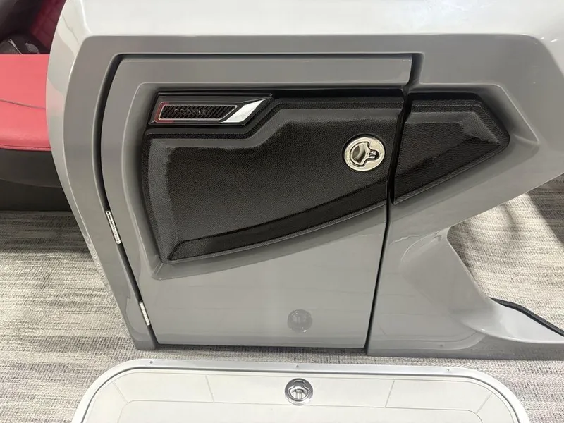 Slide: The Image of Control panel of 2025 Godfrey AquaPatio 235 DFLC iMPACT boat, featuring sleek design and secure lock. - 11