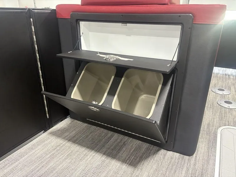Slide: The Image of Storage compartment with bins on a 2025 Godfrey AquaPatio 235 DFLC iMPACT pontoon boat. - 12