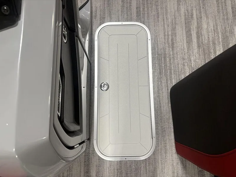 Slide: The Image of 2025 Godfrey AquaPatio 235 DFLC iMPACT Package boat interior with storage compartment. - 20