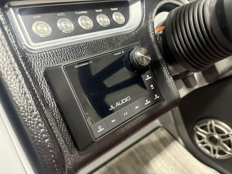 Slide: The Image of Control panel of 2025 Godfrey AquaPatio 235 DFLC with JL Audio system. - 21