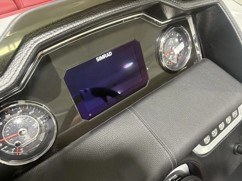 Slide: The Image of Dashboard of 2025 Godfrey AquaPatio 235 DFLC with Simrad display and gauges. - 28