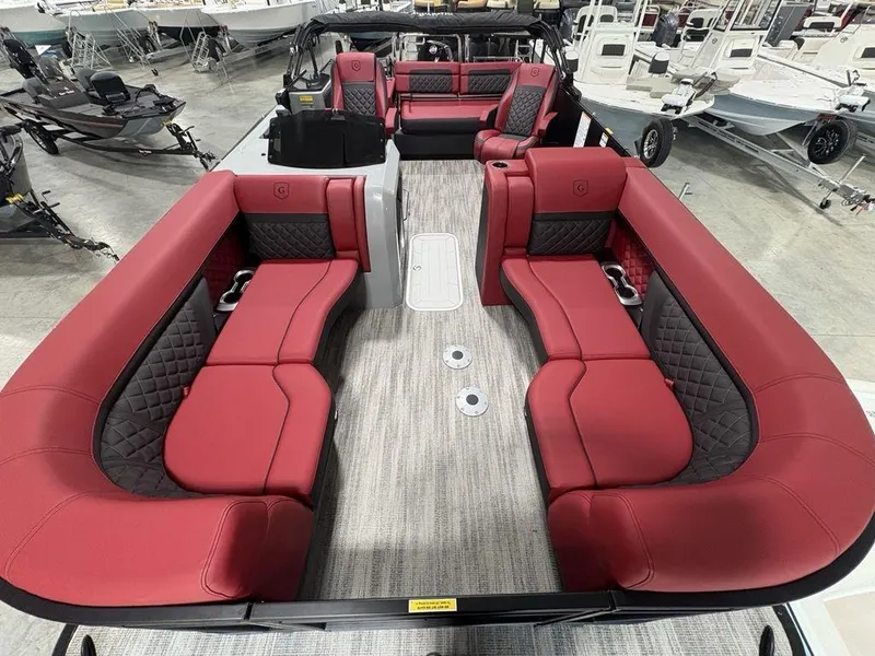 Slide: The Image of 2025 Godfrey AquaPatio 235 DFLC boat interior with red and black seating. - 32