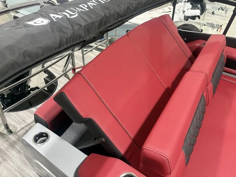 Slide: The Image of Red seating on 2025 Godfrey AquaPatio 235 DFLC iMPACT pontoon boat, featuring cup holders. - 36
