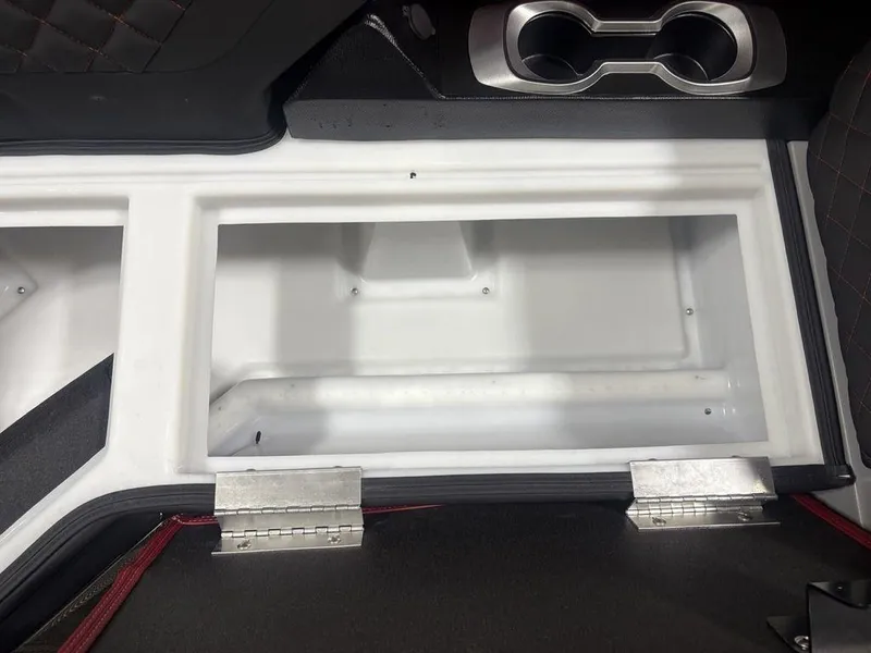Slide: The Image of Interior storage compartment of 2025 Godfrey AquaPatio 235 DFLC boat with cup holders. - 4