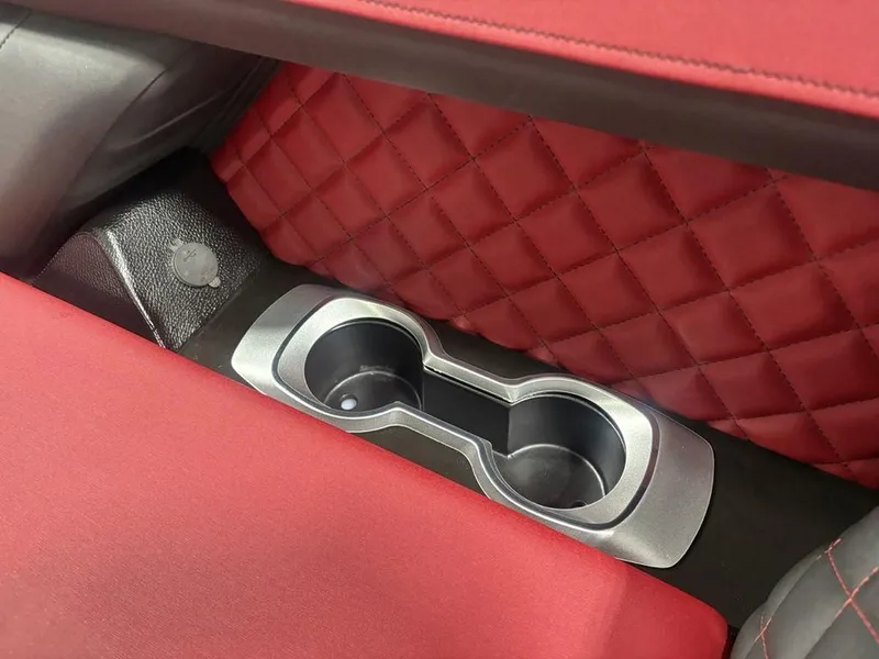 Slide: The Image of Red quilted interior with cup holders in 2025 Godfrey AquaPatio 235 DFLC boat. - 5