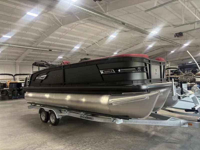 Slide: The Image of 2025 Godfrey AquaPatio 235 DFLC pontoon boat on trailer in showroom. - 7
