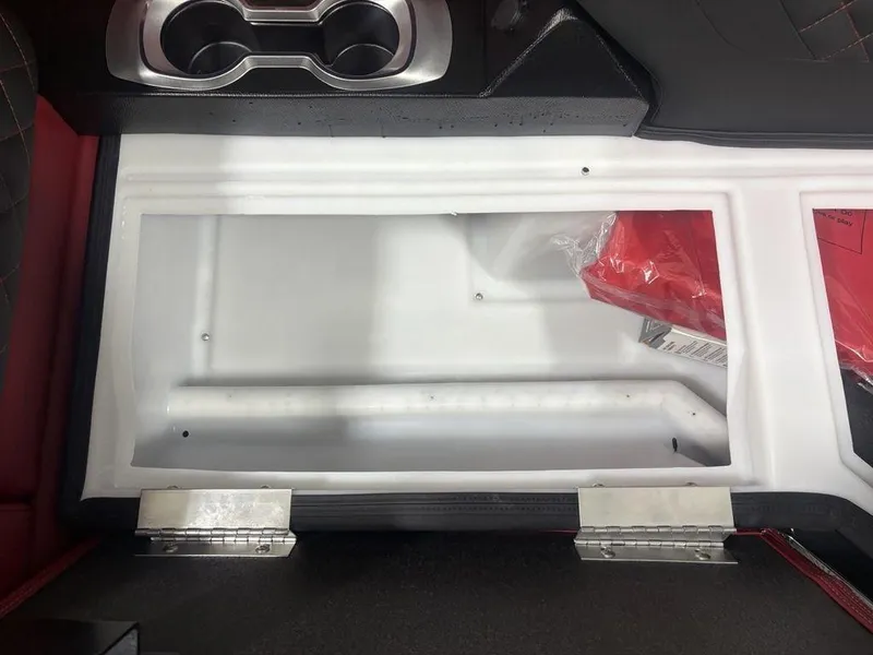 Slide: The Image of Interior storage compartment of 2025 Godfrey AquaPatio 235 DFLC boat with cup holders. - 9