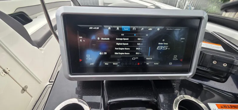 Slide: The Image of Dashboard of 2023 Yamaha Boats 252SD showing digital display with navigation and engine data. - 13