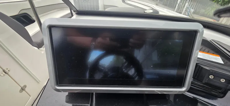 Slide: The Image of 2023 Yamaha Boats 252SD dashboard with touchscreen display, showcasing modern boat technology. - 34