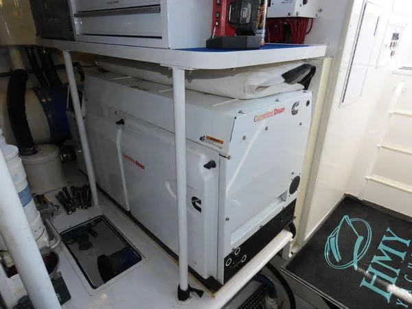 Slide: The Image of Engine room of 2009 Viking 64 Convertible with Cummins Onan generator. - 10