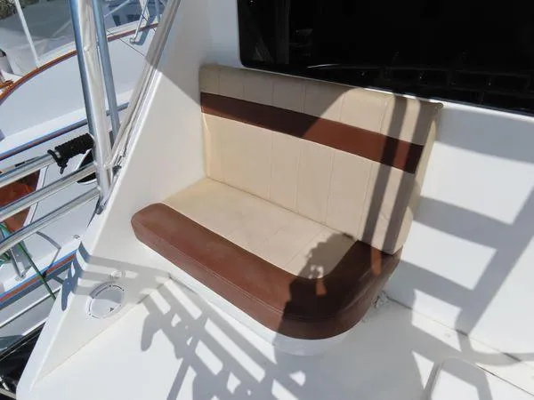 Slide: The Image of Brown and beige seat on 2009 Viking 64 Convertible yacht deck. - 19