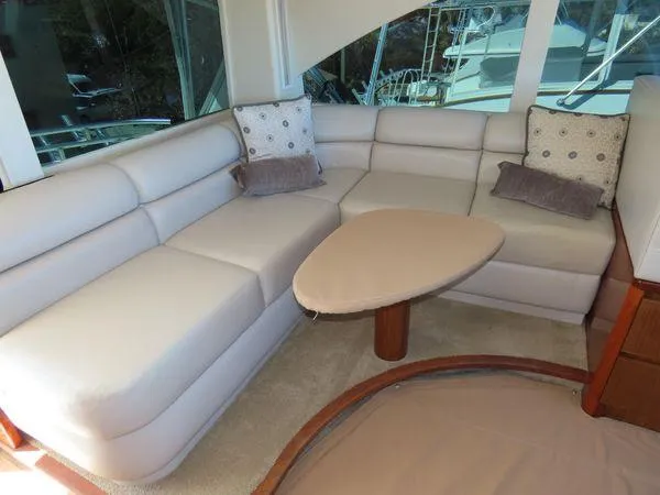 Slide: The Image of Luxurious interior of 2009 Viking 64 Convertible yacht with plush seating and stylish decor. - 20