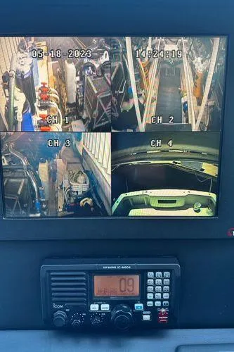 Slide: The Image of Surveillance monitor on 2009 Viking 64 Convertible yacht displaying four camera feeds. - 26