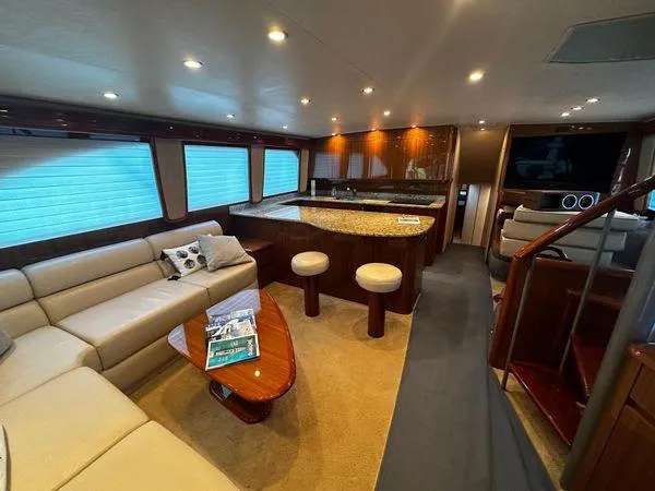 Slide: The Image of Luxurious interior of a 2009 Viking 64 Convertible yacht with elegant seating and modern amenities. - 32