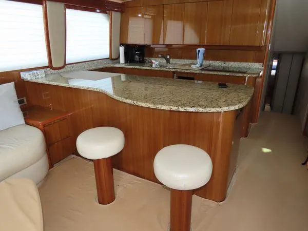 Slide: The Image of Luxurious kitchen interior of 2009 Viking 64 Convertible yacht with granite countertops. - 35