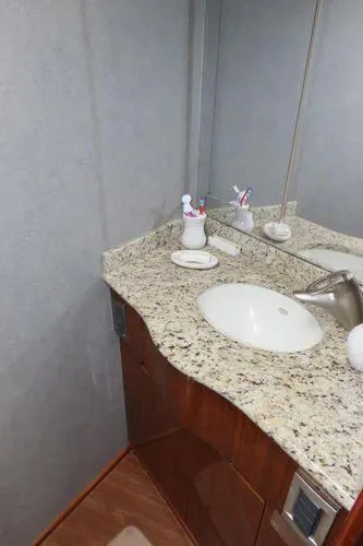 Slide: The Image of Bathroom interior of 2009 Viking 64 Convertible yacht with granite countertop. - 39