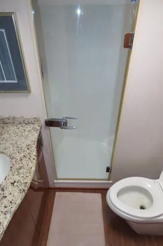 Slide: The Image of Bathroom interior of 2009 Viking 64 Convertible yacht with shower and toilet. - 41