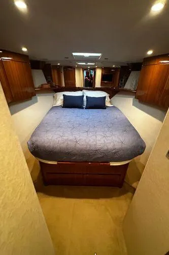Slide: The Image of Luxurious bedroom interior of 2009 Viking 64 Convertible yacht with elegant wood finishes. - 47