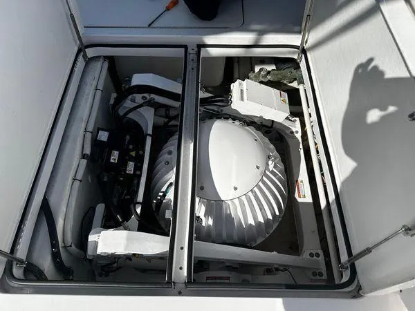 Slide: The Image of Engine compartment of a 2009 Viking 64 Convertible yacht, showcasing mechanical components. - 8