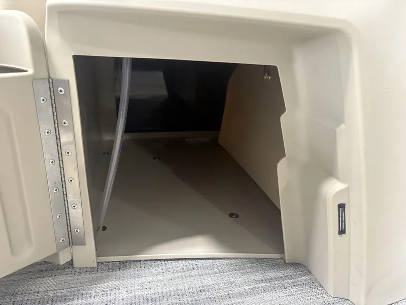 Slide: The Image of Open storage compartment in 2025 Godfrey Sweetwater 2286 SFLC boat, featuring durable interior design. - 16