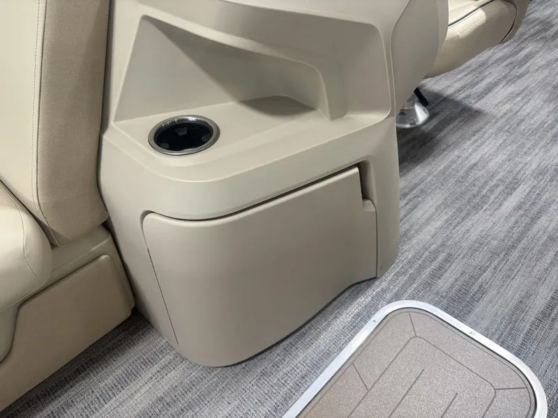 Slide: The Image of Beige interior of 2025 Godfrey Sweetwater 2286 SFLC with cup holder and storage compartment. - 18