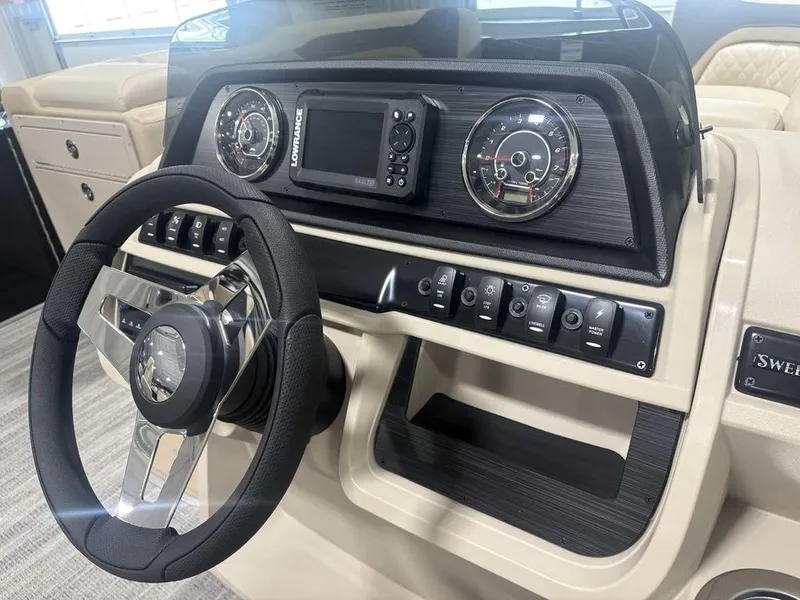 Slide: The Image of 2025 Godfrey Sweetwater 2286 SFLC dashboard with steering wheel and control panel. - 22