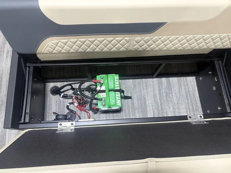 Slide: The Image of Battery compartment of 2025 Godfrey Sweetwater 2286 SFLC boat, featuring Interstate battery. - 29