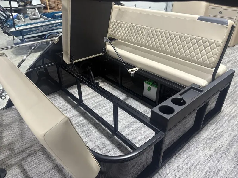 Slide: The Image of 2025 Godfrey Sweetwater 2286 SFLC boat interior with beige seating and storage compartments. - 31