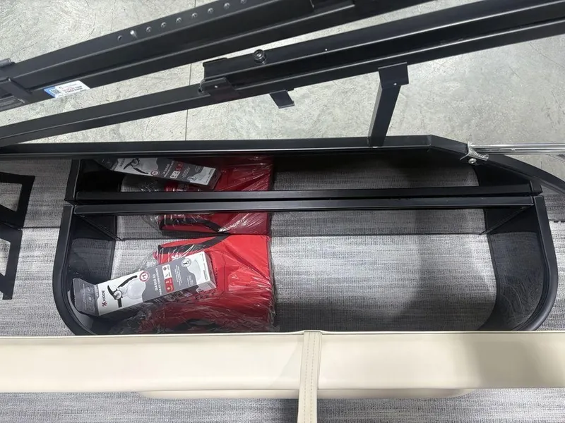Slide: The Image of Storage compartment of 2025 Godfrey Sweetwater 2286 SFLC boat with red life jackets. - 33