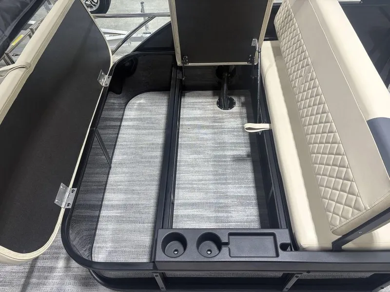 Slide: The Image of 2025 Godfrey Sweetwater 2286 SFLC boat interior with storage compartments and cushioned seating. - 34